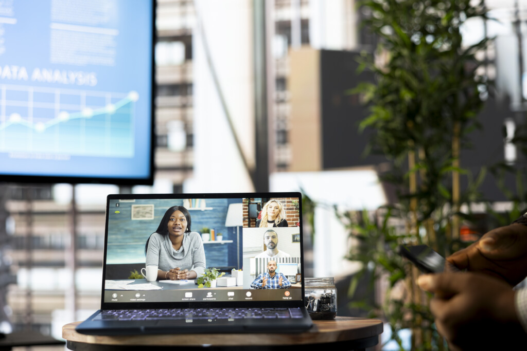 Businessman in workspace doing online videocall with management executive